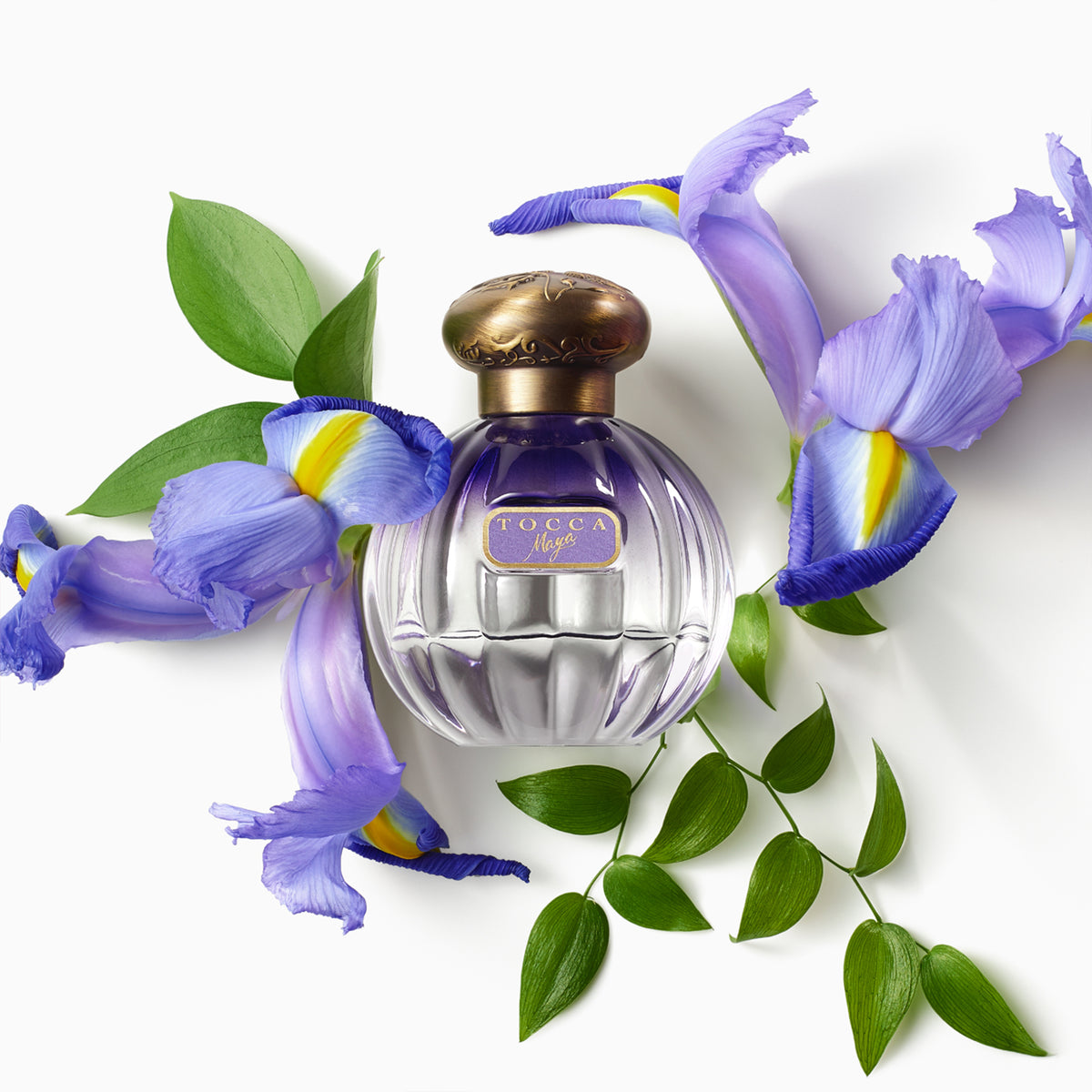 Maya Eau de Parfum bottle with flower 