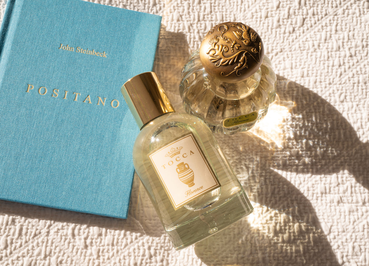 TOCCA Florence Eau de Parfum bottle next to John Steinbeck's Positano book