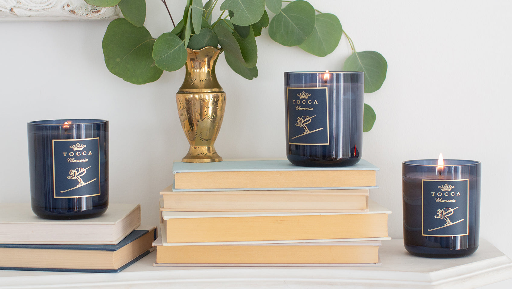 Candela Classica products on books with plant